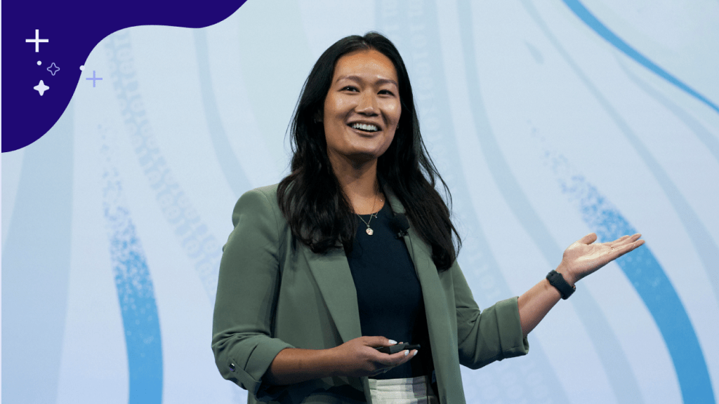 A person presenting on stage.