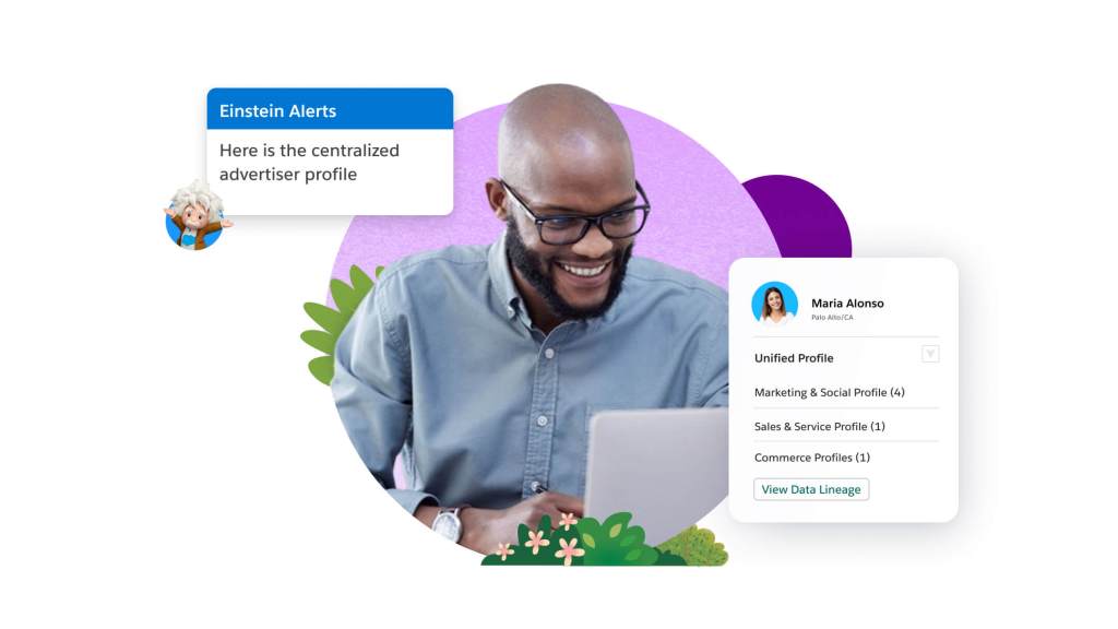 A man looking at a laptop and receiving Einstein alerts on advertiser profiles.